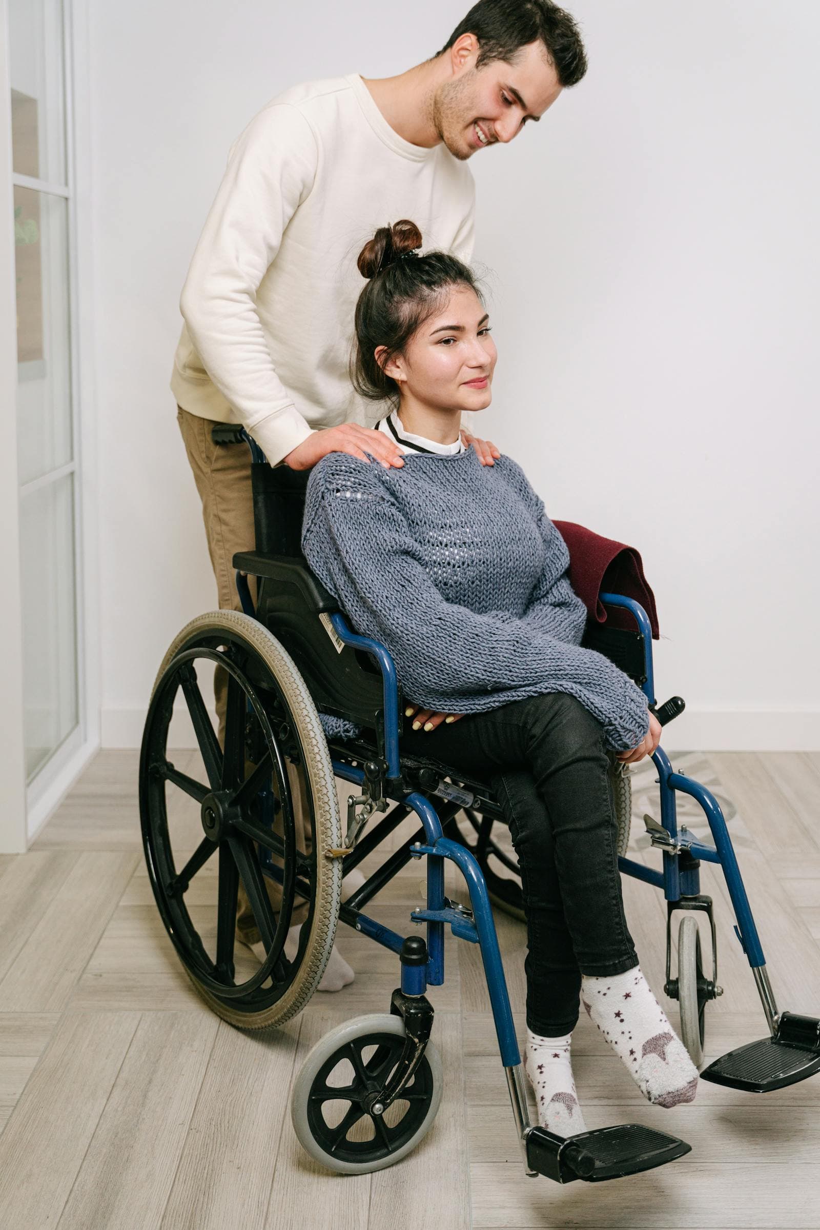 A First Priority Care support worker engaging with a participant in compassionate, personalized NDIS care